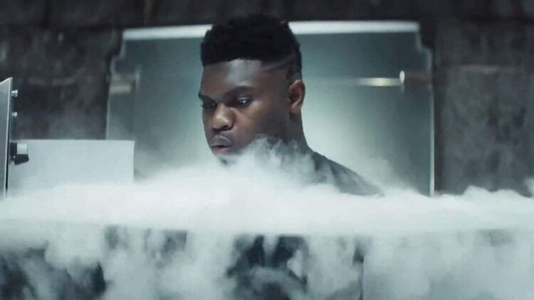 Athlete mid-recovery stepping into the Cryo Tempe cryotherapy chamber
